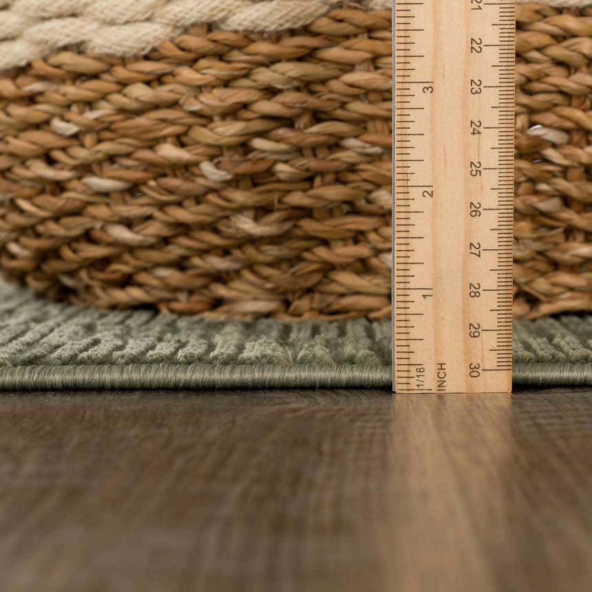 Close-up of the green Truls 3D Checkered Washable Rug showing the texture and thickness, measured with a ruler. Pile