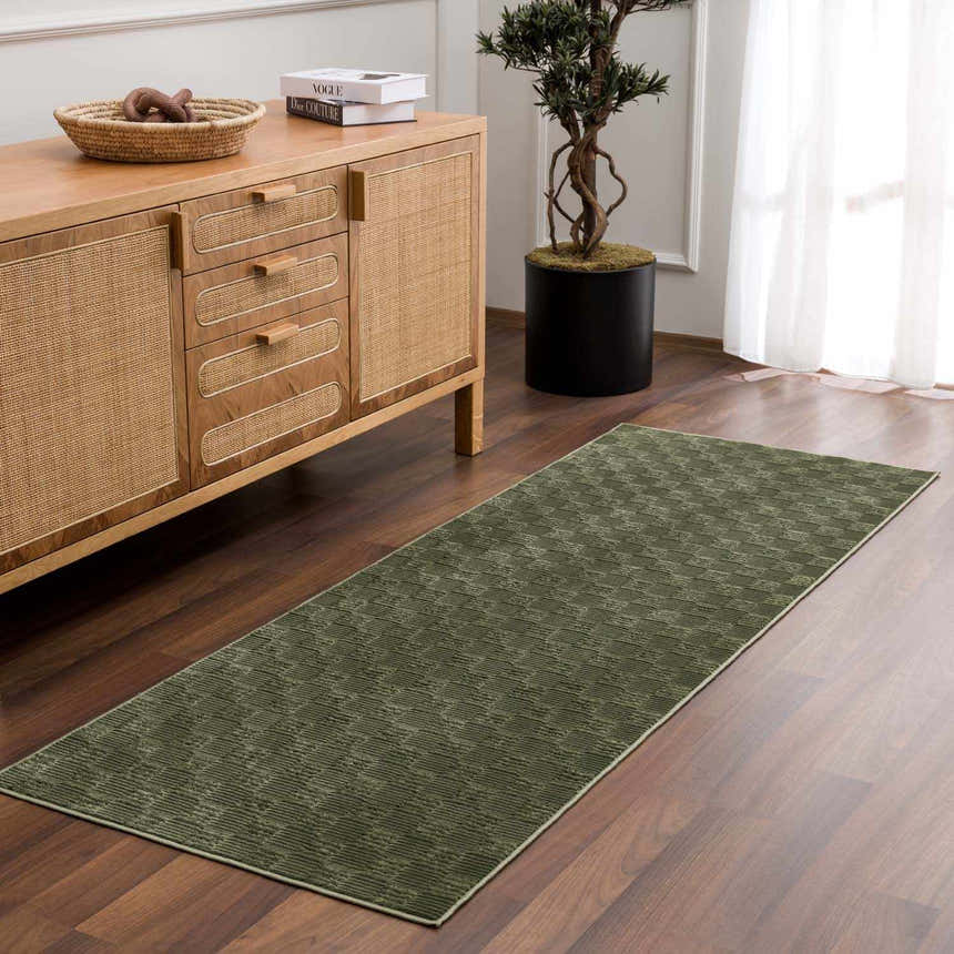 Hallway scene with a green Truls 3D Checkered Washable Rug, wood floors, and a light wood cabinet. Roomscene-Runner
