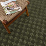 Close-up of the green Truls 3D Checkered Washable Rug, showing its textured checkered pattern and rich color. Styleshot
