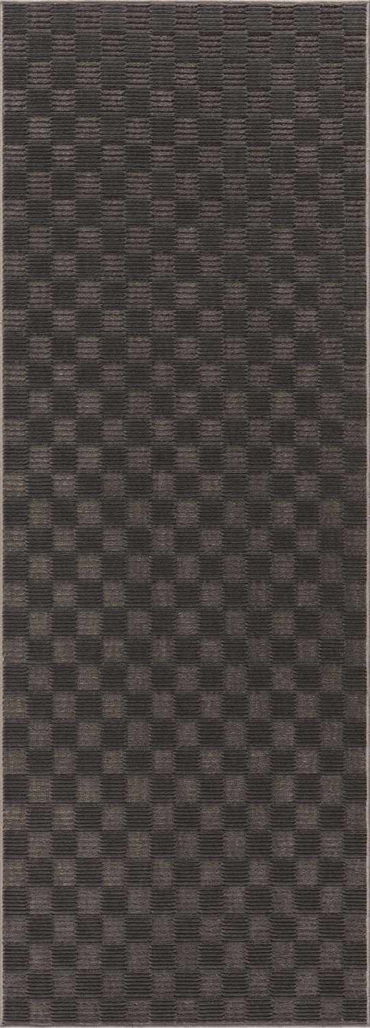 Close-up of the Truls 3D Checkered Washable Rug, black and gray polyester with a textured checkered pattern. Design-Runner-2773