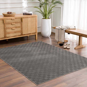 Entryway with wood floors and Truls 3D Checkered Washable Rug in Black, with a sideboard and bench. Roomscene-Rectangle