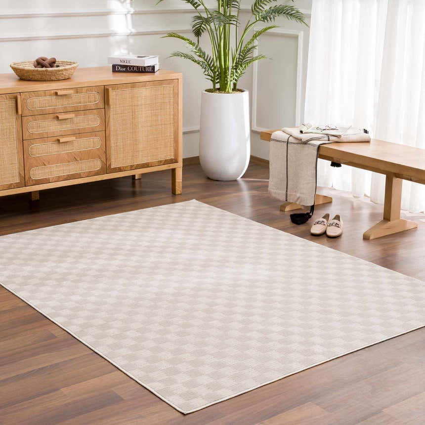 Entryway with a biscotti Truls 3D Checkered Washable Rug, wood floors, console table, bench, and plant. Neutral tones. Roomscene-Rectangle
