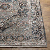 Close up of the Baychester Brown Area Rug showing its traditional oriental pattern and dark brown, denim, and sage colors. Front