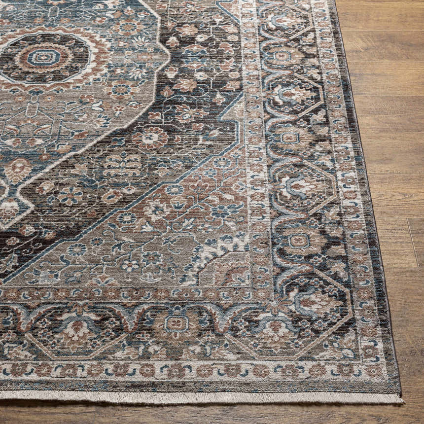 Close up of the Baychester Brown Area Rug showing its traditional oriental pattern and dark brown, denim, and sage colors. Front