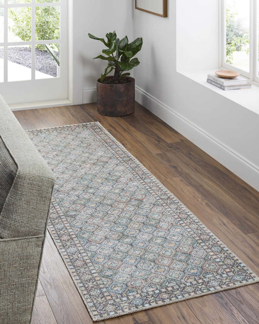 Entryway with Telma Medium Green Washable Area Rug, wood floors, gray sofa, potted plant, and natural light. Roomscene-Runner