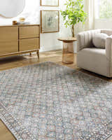 Living room scene with Telma Medium Green Washable Area Rug, light wood furniture, and neutral armchair. Farmhouse style. Roomscene-Rectangle