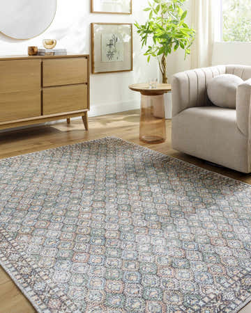 Living room scene with Telma Medium Green Washable Area Rug, light wood furniture, and neutral armchair. Farmhouse style. Roomscene-Rectangle