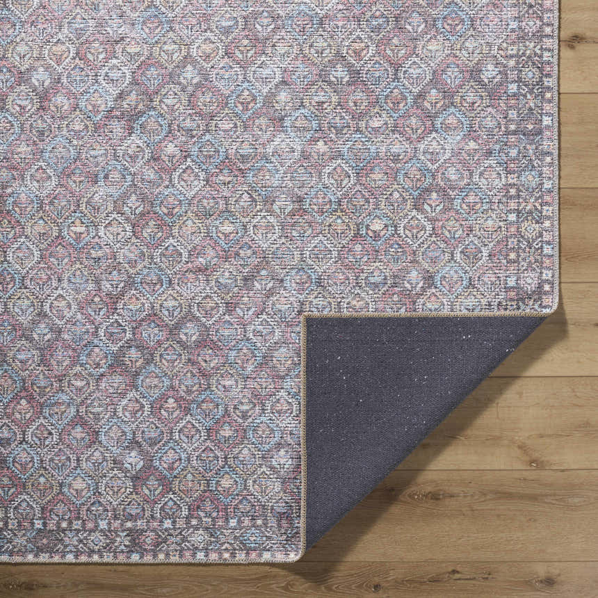 Close-up of Telma Red Washable Area Rug showing a traditional, farmhouse-style design with aqua, red, and cream colors. Fold