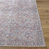 Close-up of the Telma Red Washable Area Rug showing its traditional design, and colors: red, aqua, cream, and mustard. Front