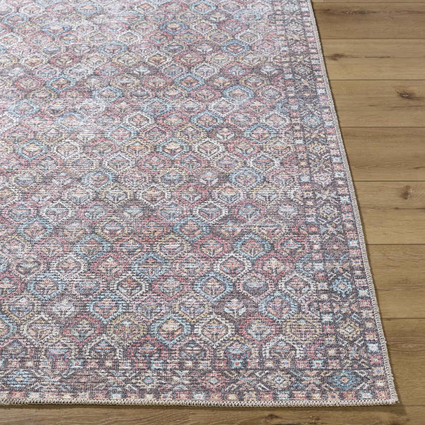 Close-up of the Telma Red Washable Area Rug showing its traditional design, and colors: red, aqua, cream, and mustard. Front