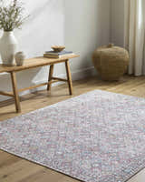 Entryway with wooden bench, vases, and Telma Red Washable Area Rug in farmhouse style, adding color to the light wood floor. Roomscene-Rectangle
