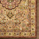 Close up of the hand-tufted Annick Area Rug. Farmhouse style wool rug with traditional floral pattern in shades of peach, green, and cream. Swatch