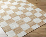 Close-up of a hand-woven Tyhir Checkered Jute Rug with a light brown and white checkerboard pattern. Corner