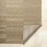 Close-up of the Thana Brown Area Rug showing its camel, tan, and prairie dust color and woven texture. Fold