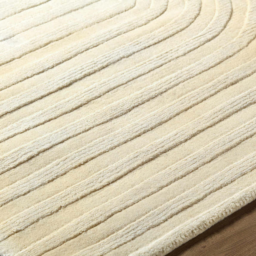 Close-up of the light silver Thema Area Rug. Hand-loomed wool rug with a contemporary, striped design. Texture