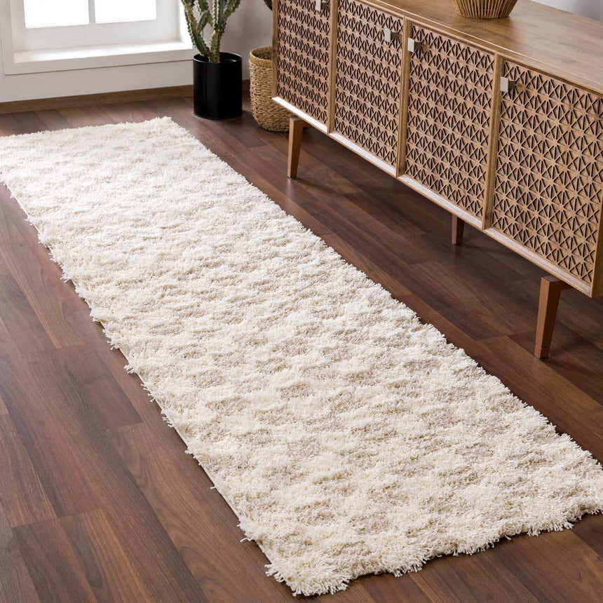 Hallway scene with a light brown geometric cabinet and Atira Light Brown Checkered Area Rug runner on dark wood floor. Roomscene-Runner
