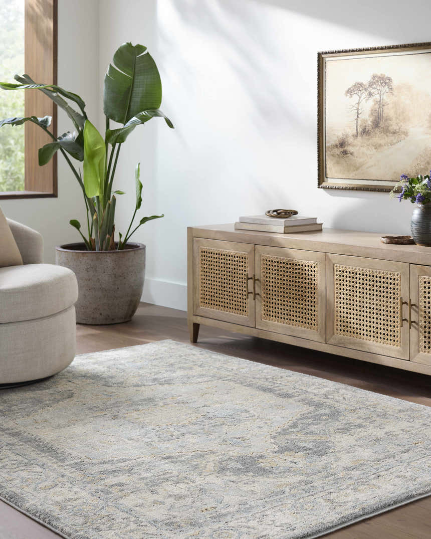 Living room scene with a beige chair, light wood cabinet, and the Vaeda Blue Thick Luxe Rug. Roomscene-Rectangle