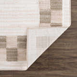 Close-up of Azrika Beige Checkered Washable Rug showing beige and brown geometric pattern and non-slip backing. Fold
