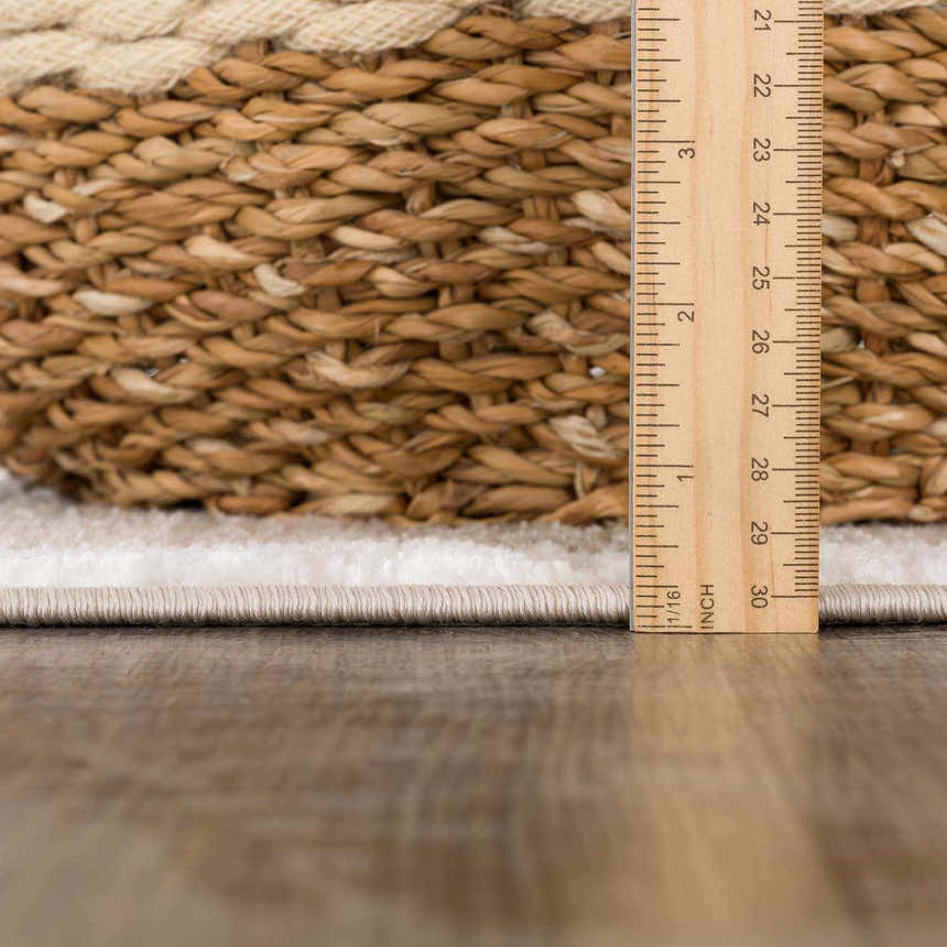 Close-up of the Azrika Beige Checkered Washable Rug showing the pile height and texture next to a measuring ruler. Pile