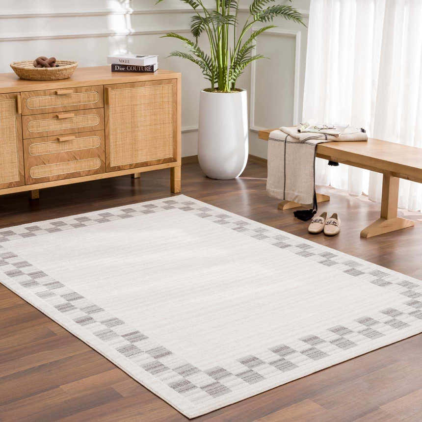 Entryway with Azrika Gray Checkered Washable Rug, wood console table, bench, and light neutral tones. Roomscene-Rectangle