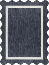 Close-up of the Varro Navy Area Rug showing the navy color, cream border, machine woven texture, and wavy edge. Design-Rectangle-537