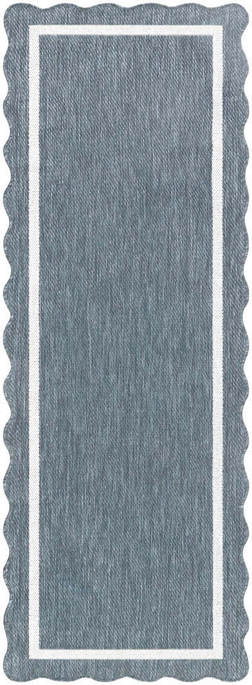 Close-up of the Varro Blue Area Rug. Features a blue woven texture, cream border, and a scalloped edge. Design-Runner-2773