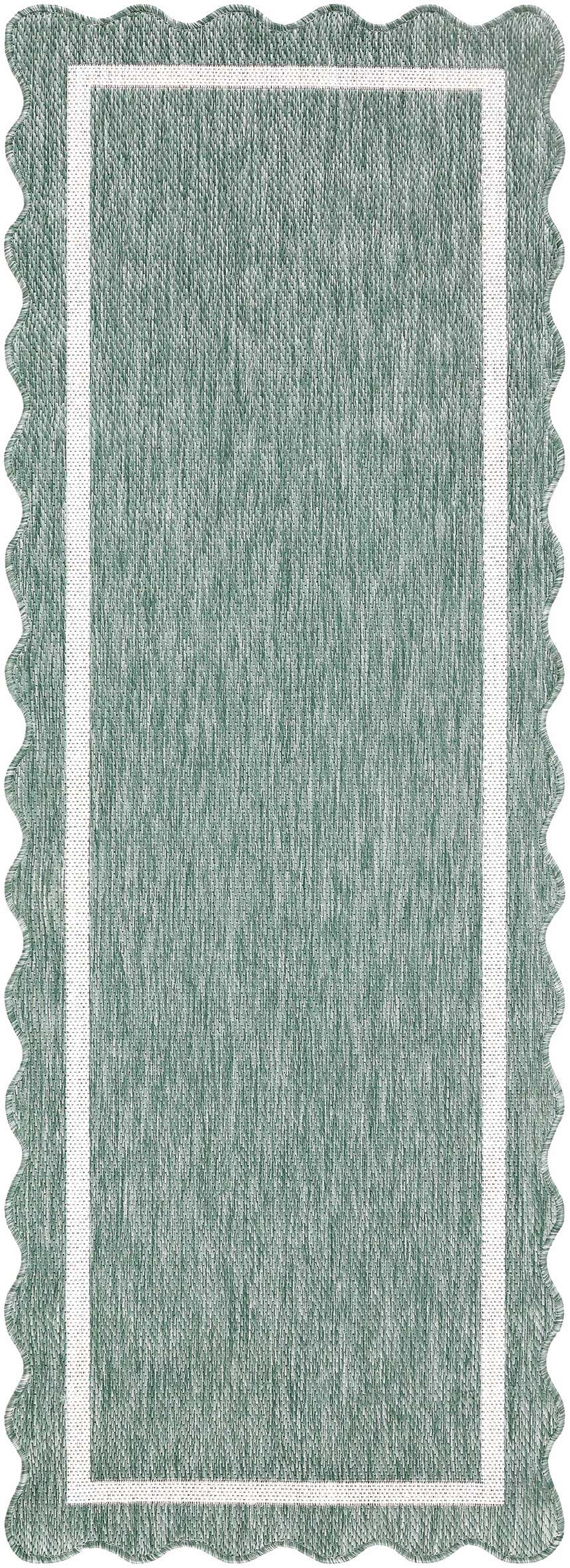 Close up of Varro Medium Green Area Rug showing texture, cream trim, and scalloped edge. Design-Runner-2773