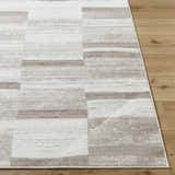 Close up of the Vasso Beige Area Rug showing a contemporary geometric pattern in light silver and warm gray. Front