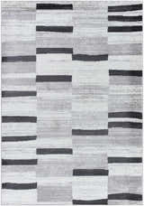 Close-up of the Vasso Gray Area Rug featuring a contemporary block pattern in ink, silver gray, and light silver. Design-Rectangle-5373