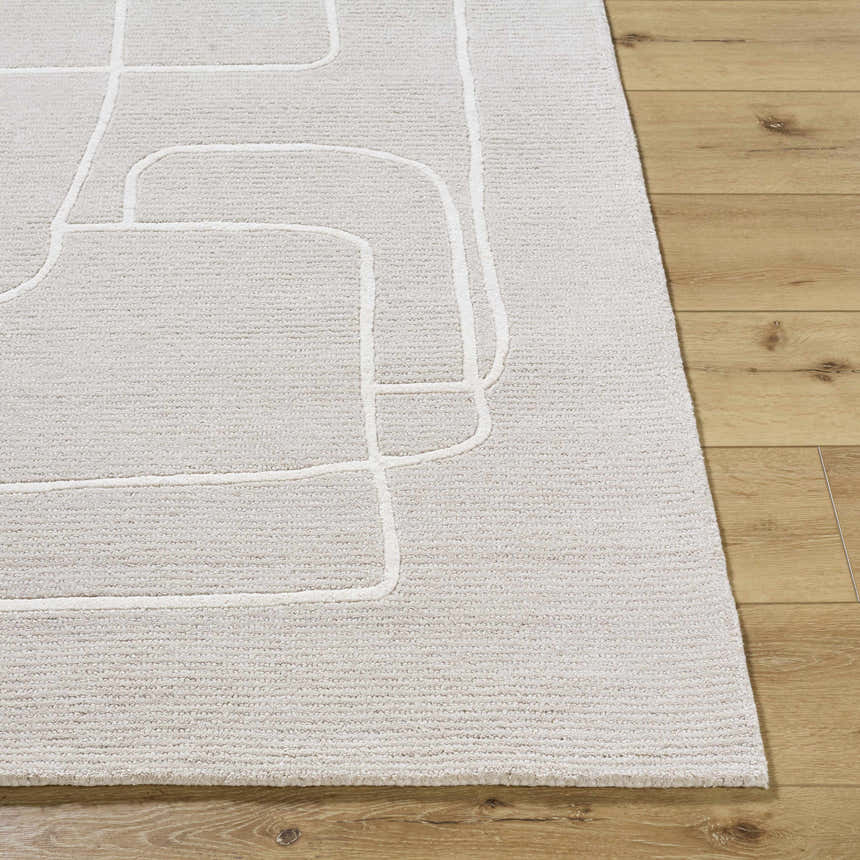 Close up of Vatsa Gray Abstract Area Rug showing the wool texture and light silver geometric design. Front