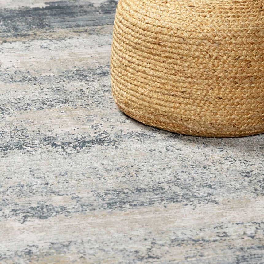 Close-up of the Whyalla Misty Thick Luxe Rug in dusty sage, light gray, and navy with a textured, contemporary design. Styleshot