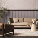 Living room scene with a cream sofa on a black and cream striped Williford Wool Area Rug. Brown leather chair and floral wallpaper. Roomscene-Rectangle
