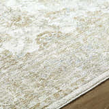 Close-up of the machine-woven Arella Area Rug. Ivory, sandstone, slate gray, and taupe colors with a traditional pattern. Texture