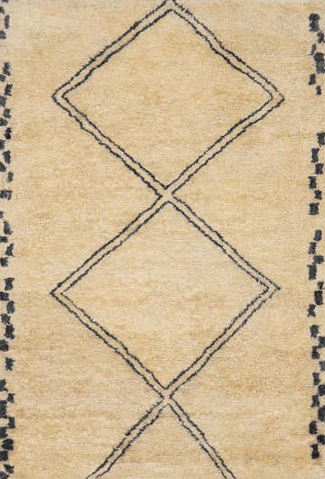 Close up of the Audrey Area Rug showing its charcoal diamond pattern on an ivory wool texture. Design-Rectangle