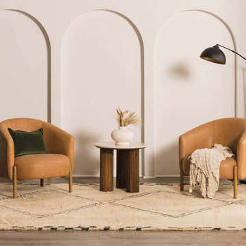 Living room scene with tan chairs, side table, and ivory Audrey Area Rug with charcoal geometric pattern. Roomscene-Rectangle