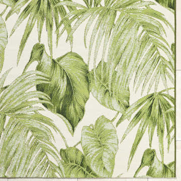 Close up of the Amirah Green Area Rug featuring an ivory base with a leafy olive pattern. Corner