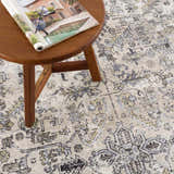 Close-up of the Holi-4606 Washable Area Rug showing its black and gold traditional vintage design and soft texture. Styleshot