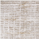 Close-up of the Ayashe Shag Area Rug. Light beige, off white, and tan shag rug with a subtle geometric pattern. Soft texture. Texture