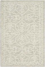Close-up of the Yadid Gray Wool Area Rug featuring a traditional light silver and gray floral pattern. Design-Rectangle
