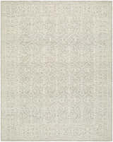 Close-up of the hand-tufted Yadid Gray Wool Area Rug featuring a traditional light silver and off-white floral pattern. Design-Rectangle-71010