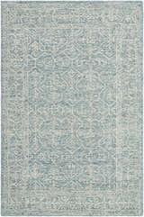 Close-up of the Yadid Area Rug. Hand-tufted wool rug in light blue with a traditional white floral pattern and border. Design-Rectangle-576