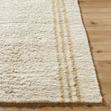 Close-up of the hand-tufted Yahto Area Rug. Camel and tan wool rug with a textured, farmhouse style design. Front