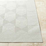Close-up of the Anabia White Area Rug showing its geometric square pattern and textured, machine-woven construction. Front