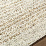 Close-up of the Yaron Area Rug showing the pearl and tan jute and wool texture and hand woven construction. Texture