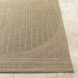 Close-up of the Yuley Brown Area Rug showing its prairie dust and tan colors, woven texture, and geometric stripe pattern. Front