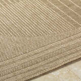 Close up of the textured, machine woven Yuley Brown Area Rug in prairie dust and tan. Texture