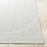 Close-up of the Yuley White Area Rug, showing the light silver color and textured, linear pattern. Front