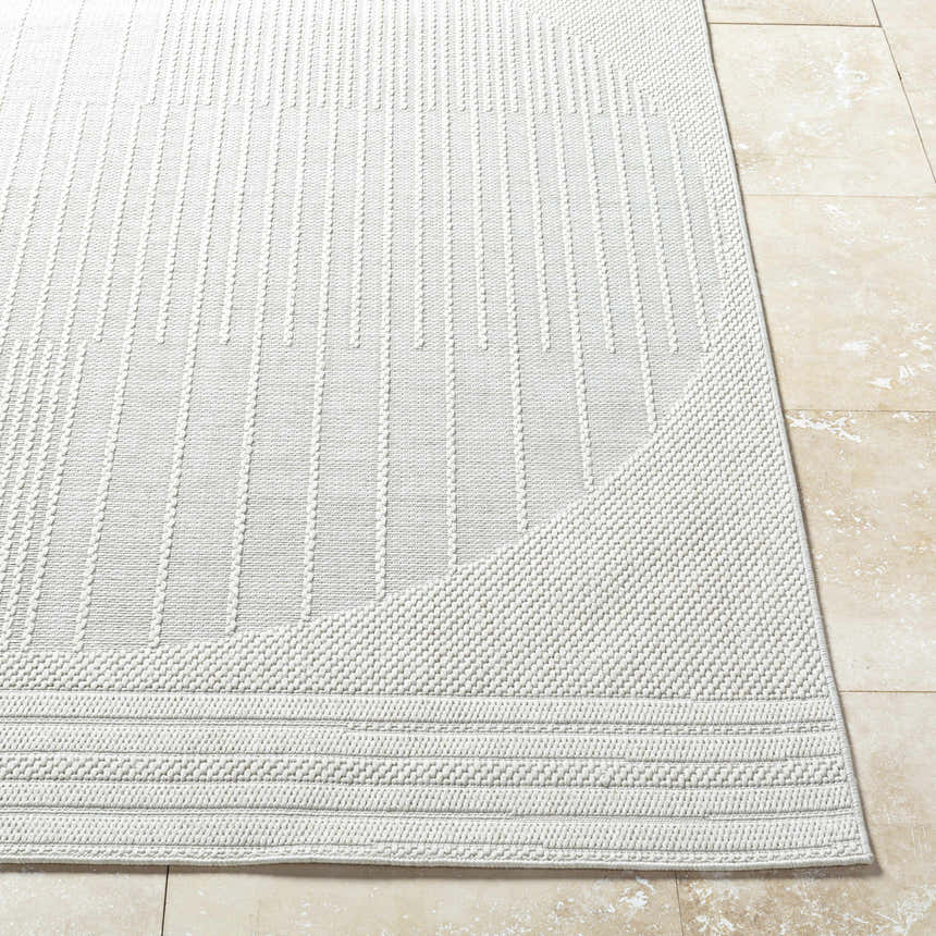 Close-up of the Yuley White Area Rug, showing the light silver color and textured, linear pattern. Front