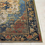 Close-up of Zorea Traditional Area Rug showing floral pattern in blue, red, gold, and black on tile floor. Front