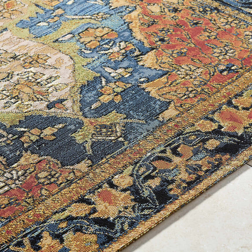 Close-up of the Zorea Traditional Area Rug, featuring a detailed floral pattern in blue, orange, gold, and black. Texture